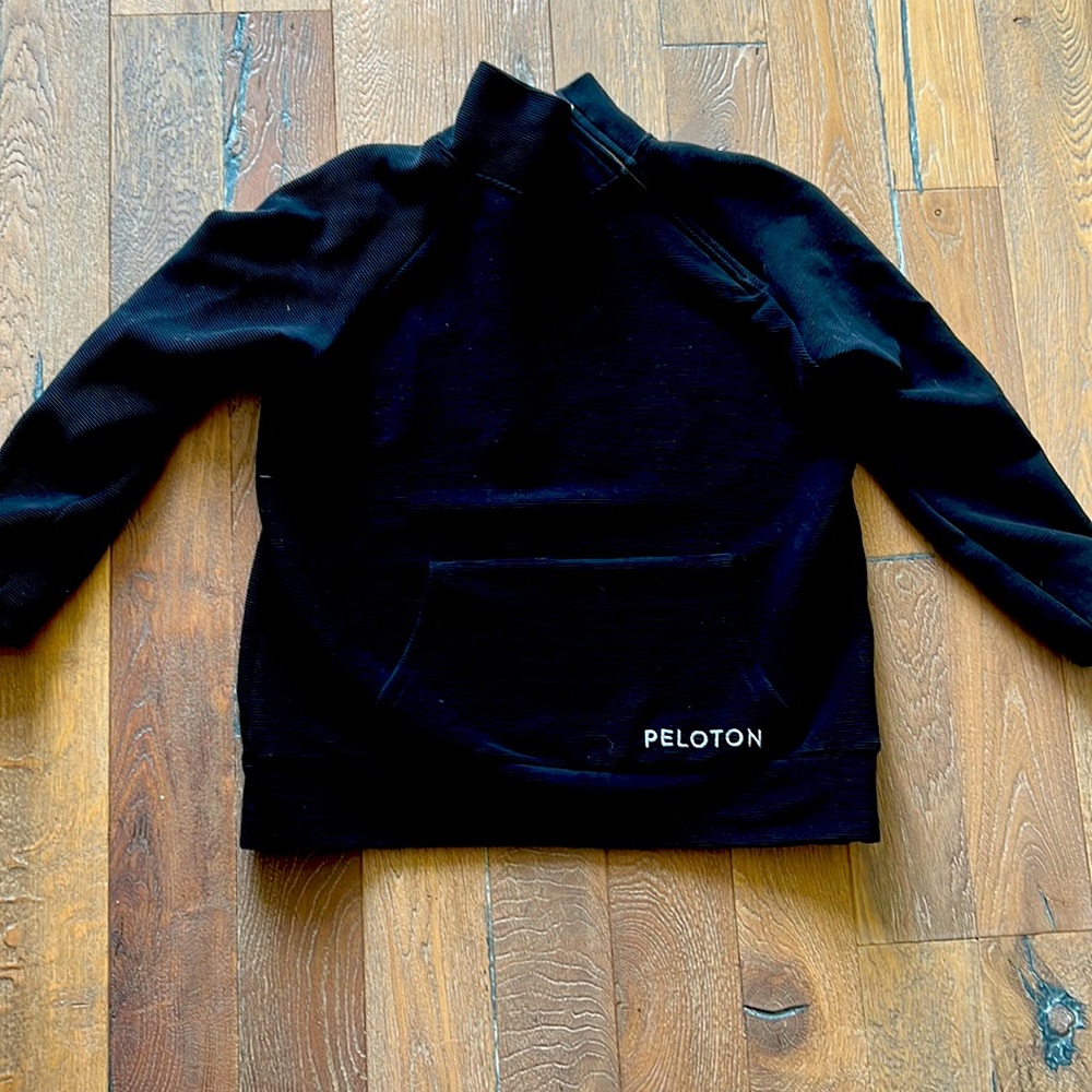 Peloton zip neck sweatshirt with front pocket.